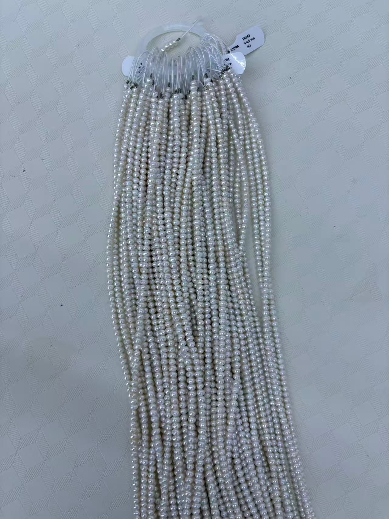 White Oval Freshwater Pearl Strand | 4–4.5mm AAA Grade