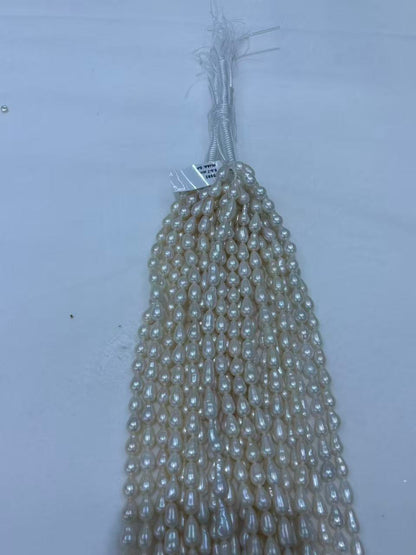 White Teardrop Baroque Freshwater Pearl Strand | 6.5–7mm AAA Grade