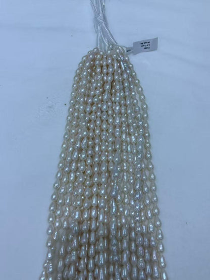 White Teardrop Baroque Freshwater Pearl Strand | 6.5–7mm AAA Grade