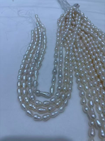 White Teardrop Baroque Freshwater Pearl Strand | 6.5–7mm AAA Grade