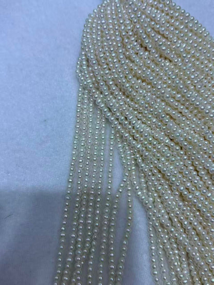 White Oval Freshwater Pearl Strand | 2–2.5mm AAA Grade | Per Strand