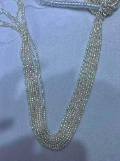 White Oval Freshwater Pearl Strand | 2–2.5mm AAA Grade | Per Strand